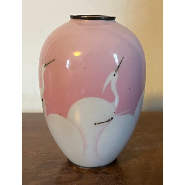 Antique 19th century Japanese Meiji wireless cloisonne vase decorated with egrets or cranes in pink and white enamels. The...