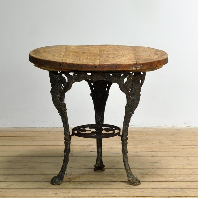 This characterful garden table combines a richly decorated cast iron base with a pine top, resulting in a particularly...