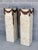 Stunning pair of tessellated stone columns. Intricate wood swag detail on each. Brass detailing on the bottom. Wonderful...
