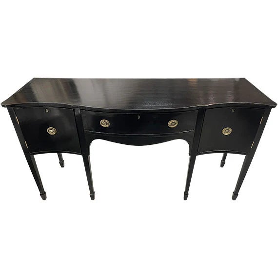 This elegant curved-front desk blends traditional craftsmanship with bold, dramatic styling. Finished in a rich black...