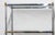 Pair of chrome and brass midcentury etageres in the style of Maison Jansen. Five shelves with faux bamboo details and...