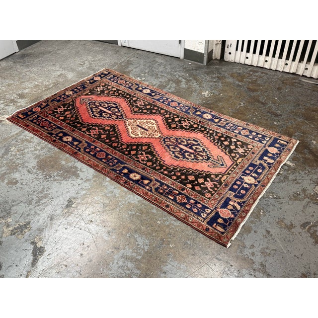 Design Plus Gallery presents a 4ft 4in × 8ft 1in Vintage Persian Hamadan Hand-Knotted Wool Area Rug. This vintage rug...