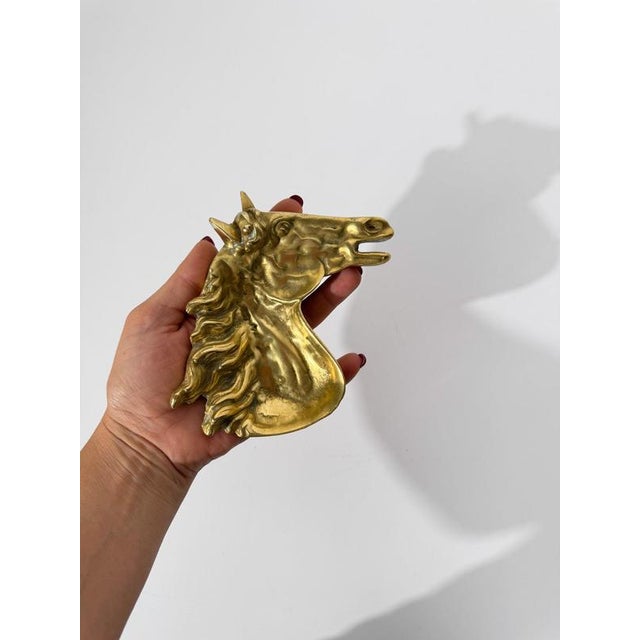 We are pleased to offer this exceptional vintage cast brass ashtray, sculpted in the form of a horse’s head. More than a...