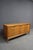 Mid-Century Modern walnut dresser attributed to United Furniture Co. Features nine drawers arranged in three columns, with...