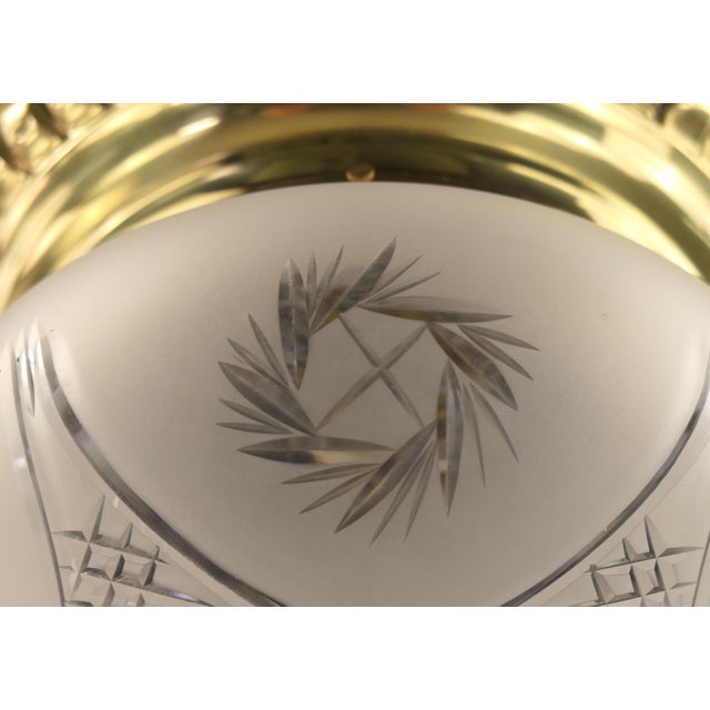 Massive brass holder with hand-cut shade. The brass surface is polished. Diameter: 30 cm, height: 20cm 1 x E27 pocelain...