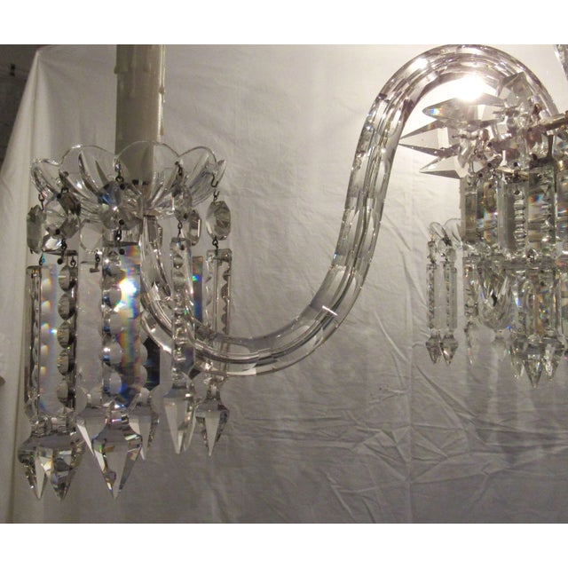 Gorgeous European crystal chandelier, early 20th century. Two sections of hanging prisms down to the center basket with...
