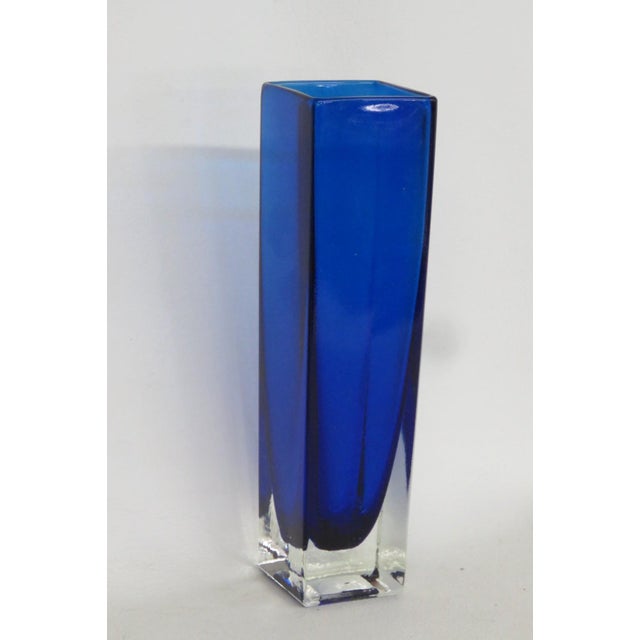 This brilliant Rectangular Vase is made of glass. This compact vase presents a lovely vintage style with a gorgeous...