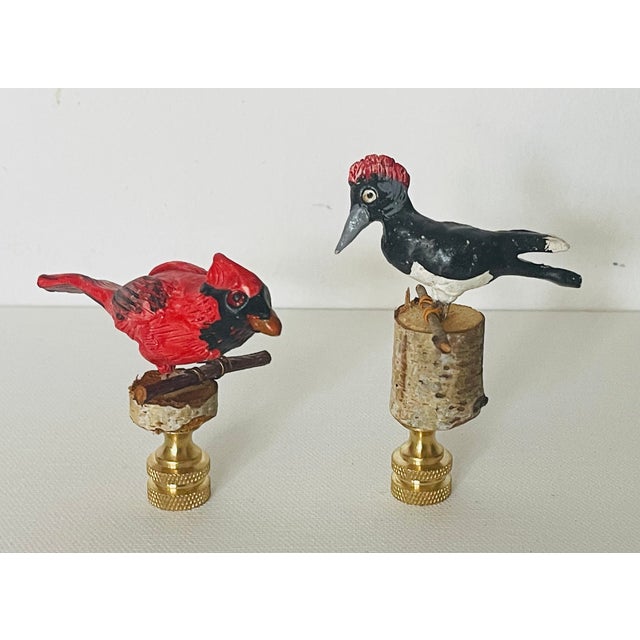 Lovely pair of handsculptured handpainted bird figurines , signed by artist with initials and mounted on brass bases as...