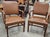 A Pair of Gunlocke Georgian Style Mahogany and Vinyl Upholstered Armchairs. Measures 23.5" in width x 25" in depth x 37"...