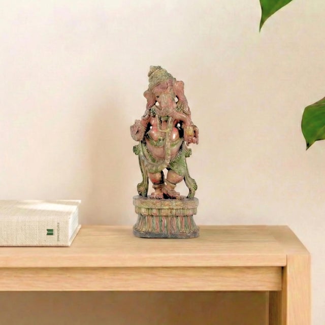 Invite the rhythmic grace of the divine into your sanctuary with this magnificent Dancing Ganesha. This is not merely a...