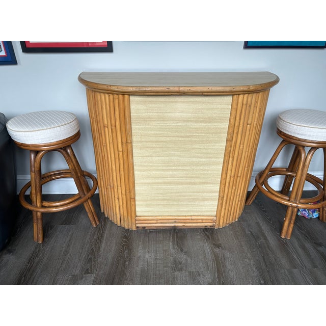 Beautiful vintage bamboo dry bar with matching upholstered stools. Excellent condition Bar 50” long 18” wide 39” tall...