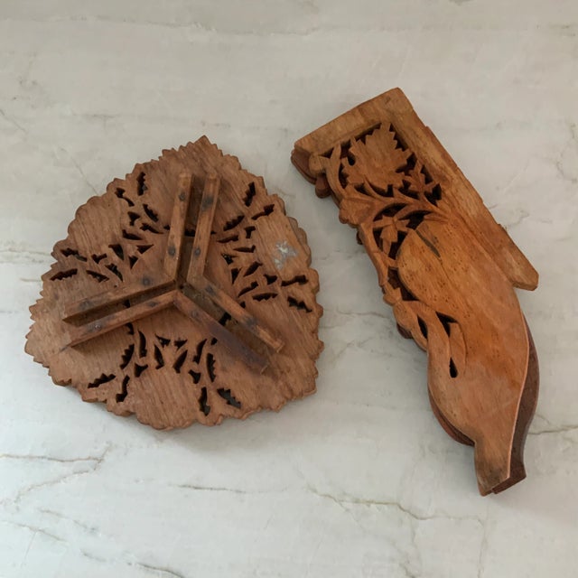 Floral carved wooden folding tabouret, which comes apart in two pieces. Could be used as a drinks or serving table. Top...