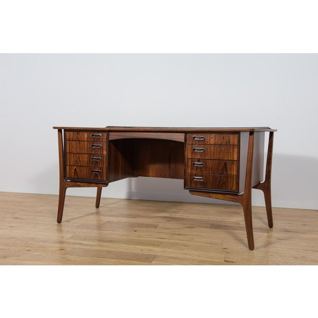 This desk is designed by Svend Åge Madsen and manufactured by H.P. Hansen in Denmark in the 1960s. It is a good example of...