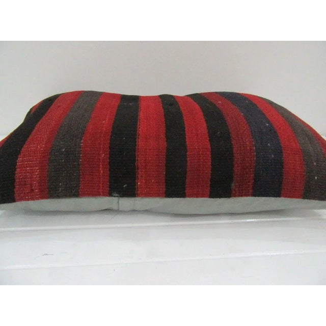 This is a pillow cover made from a vintage kilim rug. The piece was properly washed and ready to use. Pillow inserts not...