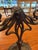 An early 20th-century Art Nouveau two-light candelabrum featuring sinuous whiplash curves, stylized floral decoration, and...