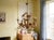 A Hollywood Regency style six-light gilt metal chandelier with tôle lily flowers. Original canopy and chain. Designed by...