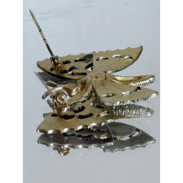 Vintage Capri butterfly brooch featuring an openwork filigree design with a lightweight, sculptural silhouette. The wings...