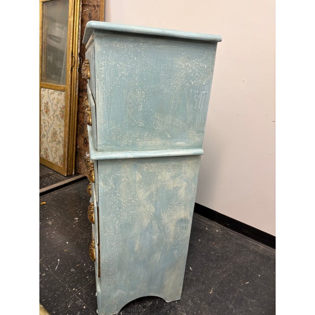 Perfect 5 drawer tall boy dresser rendered in soft tones of blue is perfect for coastal living. This chest of drawers has...