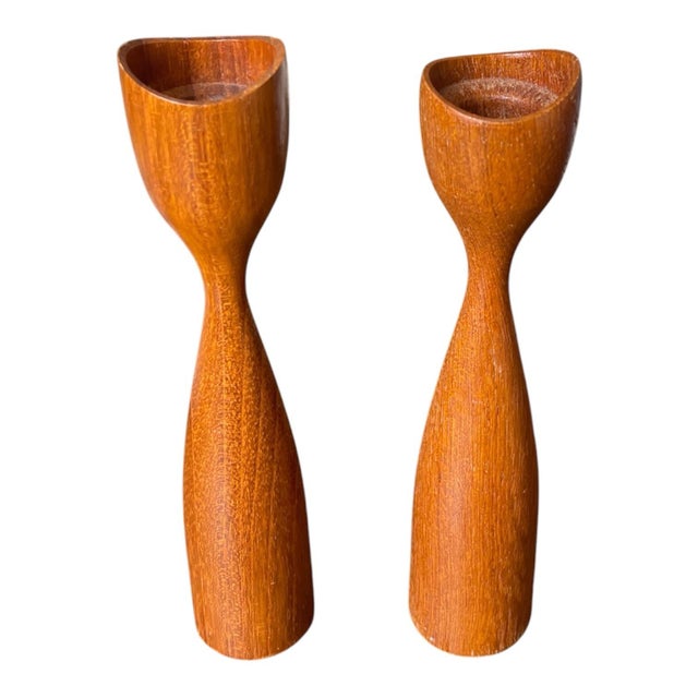 Add timeless Scandinavian design to your home with this beautiful set of three vintage Danish teak candle holders. Crafted...
