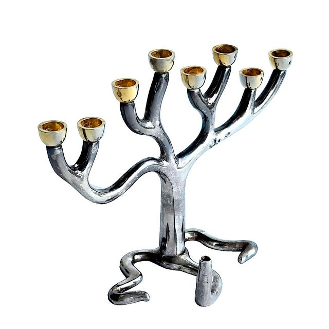 Offered is a modernist Menorah designed by Sandra Kravitz for Germany-based Rosenthal for their Judaica Collection. It is...