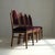 A striking set of four Dutch Amsterdam School chairs from the 1920s, executed in oak and enriched with macassar ebony...