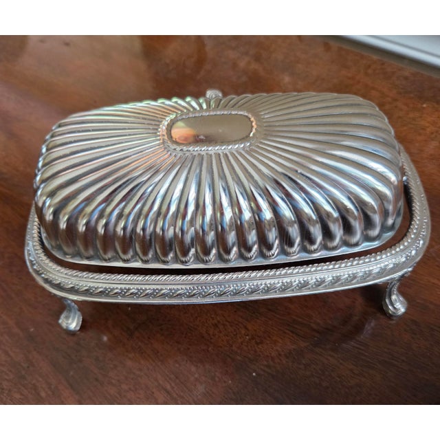 Classic Silver Plated, platform, footed butter dish. There are some esthetically pleasing design details, such as: ribbed...