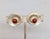 Late 1950s ridged spiral with cabochon faux-carnelian center surrounded by small round clear rhinestones clip earrings....