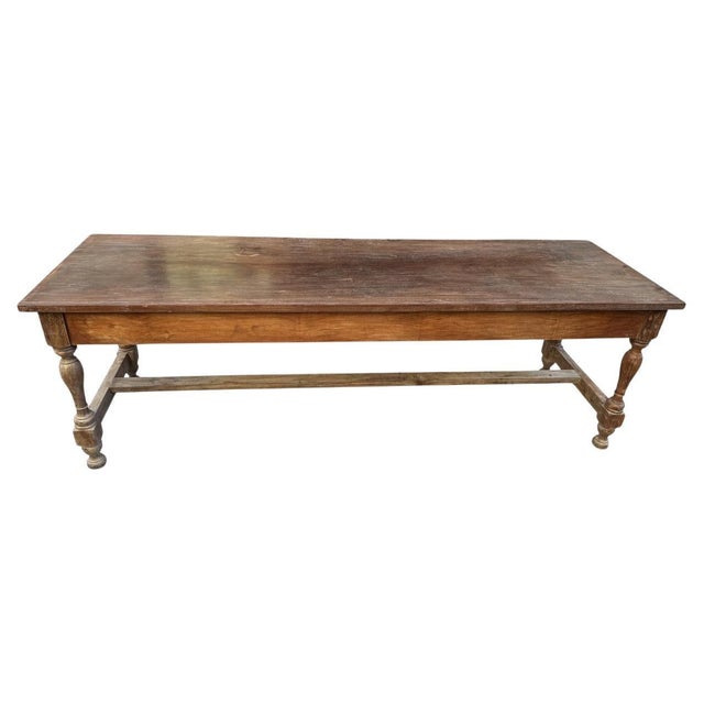 A beautiful antique teak wood console table from Sumatra. The top is a single panel with lovely patina. Finished with a...