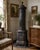 Impressive antique European cast iron parlor stove or heater, circa 1890, standing approximately 70 inches high and richly...
