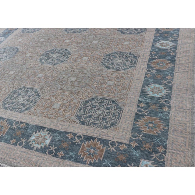 Blue Modern Hand Knotted Khotan in Wool With All-Over Medallion Design in Blue and Earthy Tones For Sale - Image 8 of 13