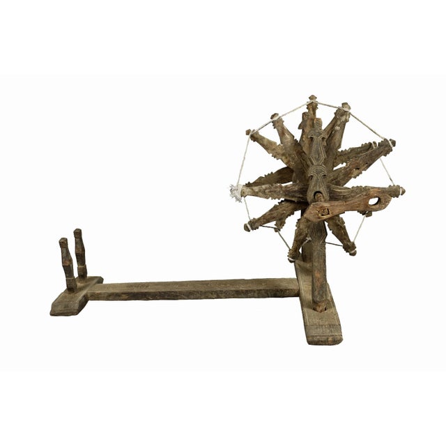 Antique very basic Traditional Spinning Wheel from Nuristan. Carved from hardwood. Length: 100 cm; width: 60 cm; height:...