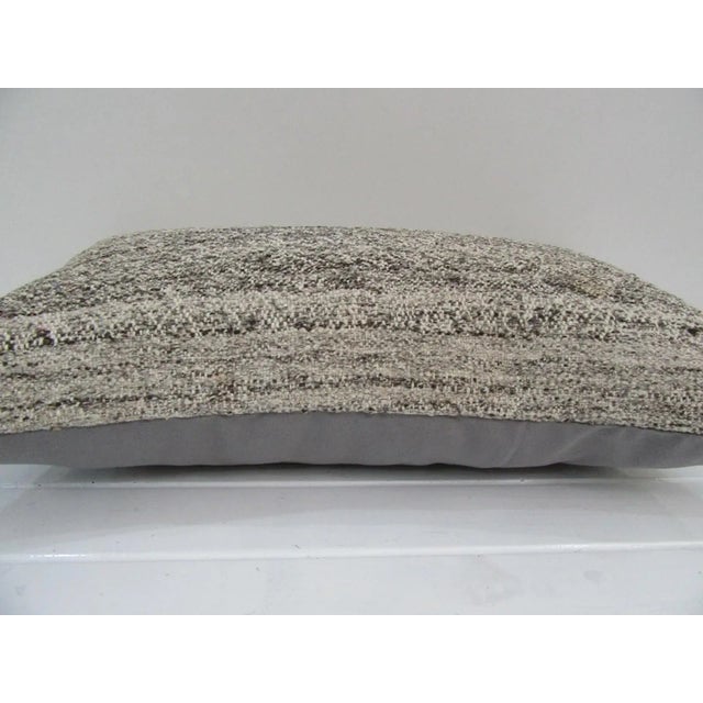 This is a pillow cover made from a vintage kilim rug. The piece was properly washed and ready to use. Pillow inserts not...