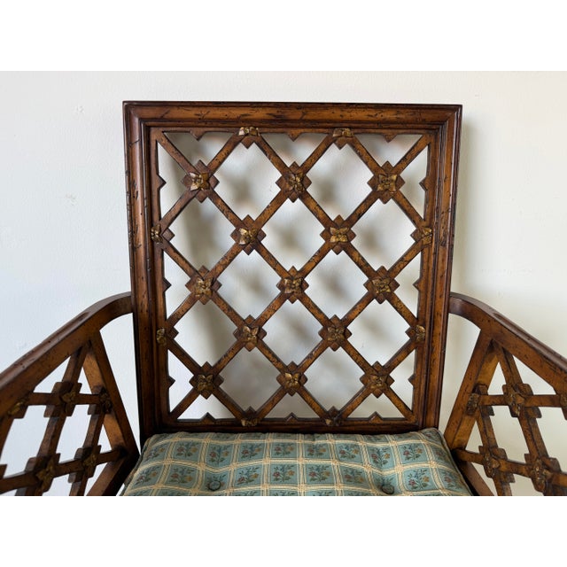 Elegant vintage Chinese Chippendale-style armchair featuring a beautifully crafted open fretwork geometric lattice back...