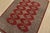 A tribal Bokhara Jaldar rug hand-knotted with fine wool on a cotton foundation. This rug features rows of repeating...