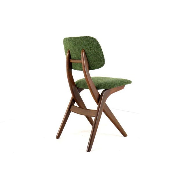 Set of 4 highly sought-after and beautiful chairs; this style is also known as the Scissors Chair due to its elegant...