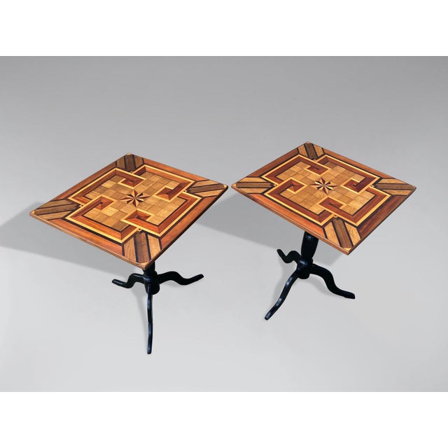 A fine pair of 19th-century geometric parquetry inlay and marquetry square top occasional tables, standing on the original...