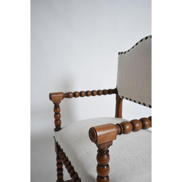 Pair of turned wood armchairs, XIXth c. Pair of armchairs in molded and turned wood, the uprights and crossbars in the...