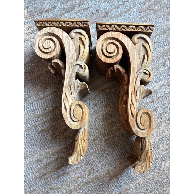 A large pair of stripped solid pine corbels dating from the late 19th century, once painted white and still retaining very...