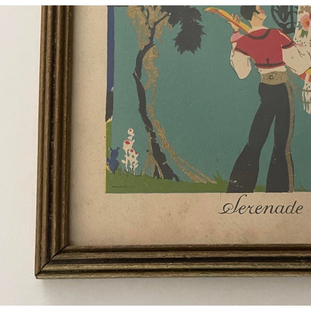 Framed 1970s lithograph print of French illustrator George Barbiers, “Serenade”. The print is framed in a metallic gold...