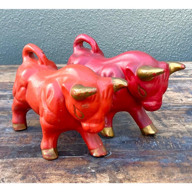 Inject dynamic energy and a touch of mid-century bravado into your vignette with this striking pair of vintage ceramic...