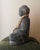 The Arhaus Seated Buddha with Beads is a substantial decorative sculpture crafted in India from dark gray cast stone. Its...