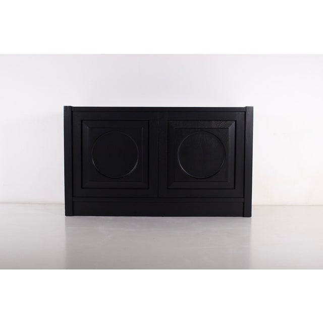 Small storage unit on a plinth in blackened oak, Brutalist style, Belgium, 1970s. The unit has been fully restored in our...