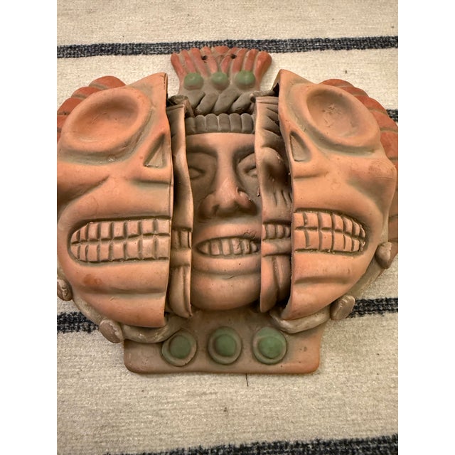The "Three Ages of Man" is a terracotta Mexican folk art mask, inspired by Teotihuacan culture, depicting the life cycle:...
