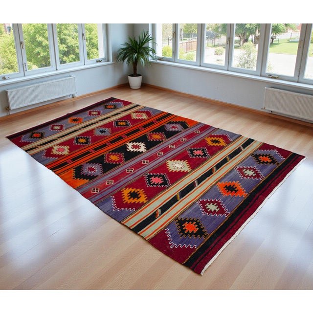Woven in the rural villages of Sivas in Central Anatolia during the 1960s, this striking flatweave kilim represents a...
