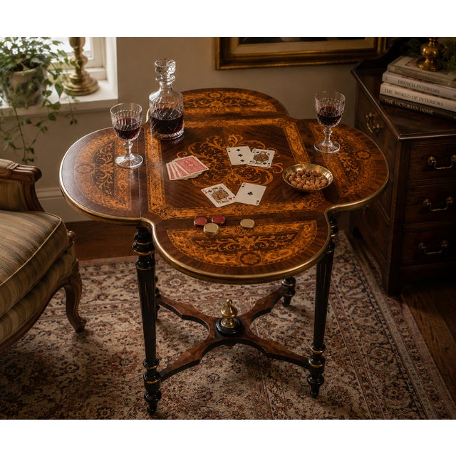A richly detailed antique Napoleon III style occasional table featuring an exceptional marquetry top with an elegant...