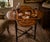 A richly detailed antique Napoleon III style occasional table featuring an exceptional marquetry top with an elegant...