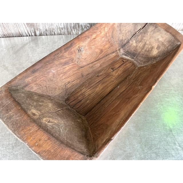 Discover the soulful appeal of this magnificent vintage hand-carved dough bowl, a true statement piece brimming with boho...