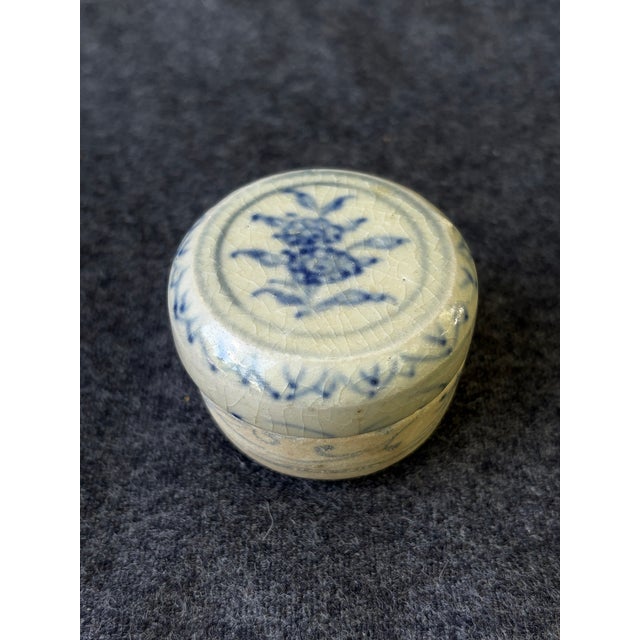 Small, round antique, porcelain jar with a soft, matte textured bottom and glossy top, each with a softly eroded wear to...