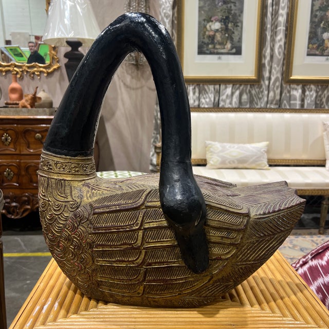 Striking 19th century Chinese swan sculpture hand carved in hardwood with an ebonized and gilt finish.