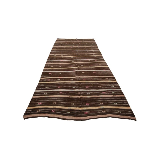 Striped Vintage handwoven kilim rug from Denizli region of Turkey. Approximately 50-60 years old. In very good condition.